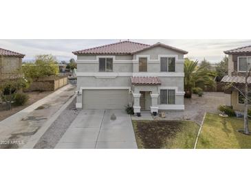 Charming two-story home featuring an attached two-car garage and low maintenance landscaping at 30419 N Plantation Dr, San Tan Valley, AZ 85143