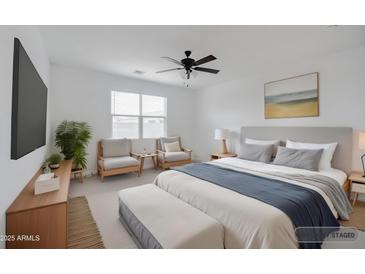 Bedroom is virtually staged with furniture, a TV, and neutral decor at 7109 E Gamebird Way, San Tan Valley, AZ 85143