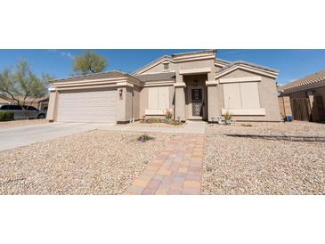 Charming single-story home with a landscaped front yard and inviting walkway at 1844 E Angelica St, Casa Grande, AZ 85122
