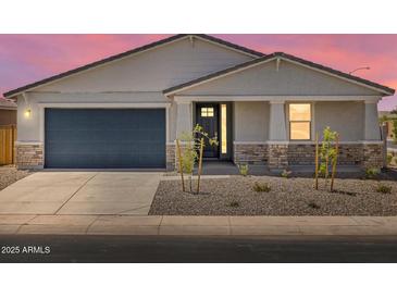 Charming single-story home with stone accents, desert landscaping, and a two-car garage at 345 S Alegria Ln, Casa Grande, AZ 85194
