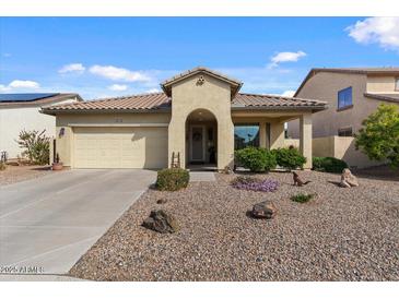 Charming single-story home with a well-maintained front yard and covered entry in a sunny setting at 144 W Bahamas Dr, Casa Grande, AZ 85122