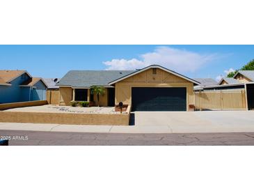 Charming single-story home featuring a two-car garage and low-maintenance desert landscaping at 16010 N 64Th Dr, Glendale, AZ 85306