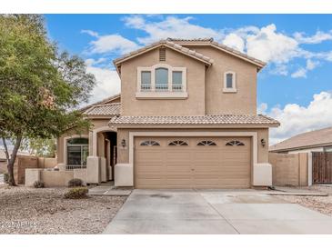 Inviting two-story home featuring a well-manicured front yard and a spacious two-car garage at 22337 E Via Del Palo --, Queen Creek, AZ 85142