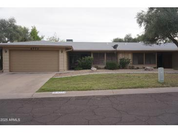 Traditional single-story home featuring a two-car garage and well-maintained landscaping at 4773 E Hopi St, Phoenix, AZ 85044