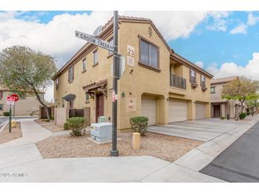 Corner lot townhome with a private entrance, two-car garage, and drought tolerant landscaping at 8105 W Groom Creek Rd, Phoenix, AZ 85043