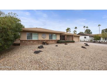 Charming home featuring a well-maintained front yard and appealing curb appeal at 8317 E Via De La Escuela --, Scottsdale, AZ 85258