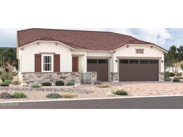 Charming single-story home featuring a two-car garage, stone accents, and desert landscaping at 2248 S 182Nd Dr, Goodyear, AZ 85338