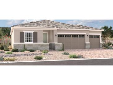 Single-story home with a neutral palette, a two-car garage, desert landscaping, and a decorative stone facade at 2254 S 182Nd Dr, Goodyear, AZ 85338