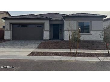 Charming single-story home with a modern design and neutral color palette at 23805 N 163Rd Dr, Surprise, AZ 85387