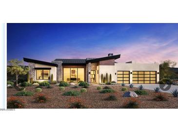 Contemporary home featuring unique architecture, desert landscaping, and an attached two-car garage at 14136 E Harmony Ln, Fountain Hills, AZ 85268