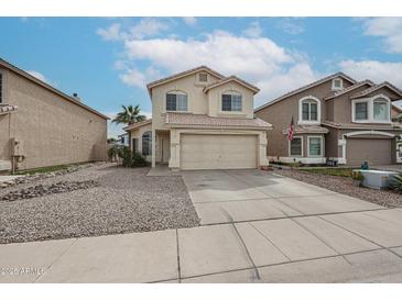 Charming two-story home with a tile roof and well-maintained front yard at 4613 E Douglas Ave, Gilbert, AZ 85234