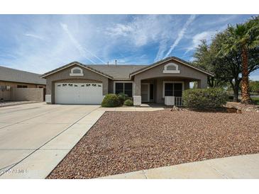 Charming single-story home featuring a two-car garage and desert landscaping for low maintenance at 19622 N 66Th Ln, Glendale, AZ 85308