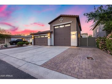 Beautiful exterior view of a home with a two-car garage and a charming driveway at 7844 W Molly Dr, Peoria, AZ 85383