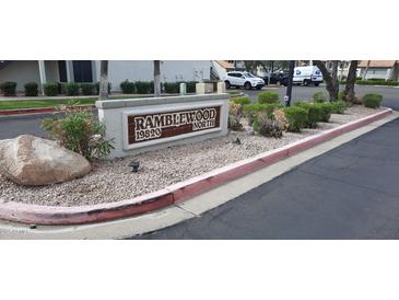 Ramblewood North entrance sign with landscaping in a well-maintained community at 19820 N 13Th N Ave # 282, Phoenix, AZ 85027