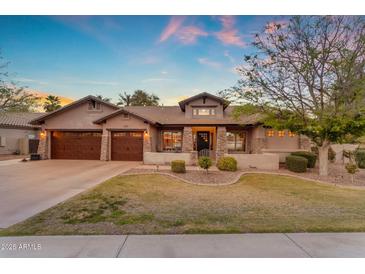 Charming home with three-car garage, stone accents, and well-maintained landscaping at 2876 E Cherrywood Pl, Chandler, AZ 85249