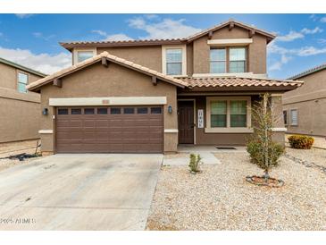 Inviting two-story home with a two-car garage and low-maintenance desert landscaping at 3126 W Apollo Rd, Phoenix, AZ 85041