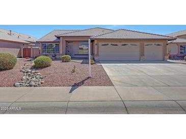Charming single-story home with a well-maintained yard and a three-car garage, perfect for comfortable living at 10913 W Chino Dr, Peoria, AZ 85373