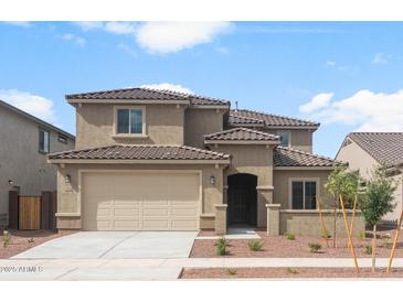 Inviting two-story home with a two car garage and desert landscaping at 17812 W Getty Dr, Goodyear, AZ 85338