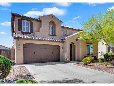 Charming two-story home features a neutral color palette, two-car garage, and well-maintained landscaping at 1961 E Stacey Rd, Gilbert, AZ 85298