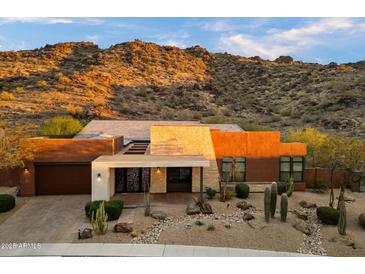 Front exterior showcasing desert landscaping and views of the McDowell Mountains at 9539 S 13Th Way, Phoenix, AZ 85042