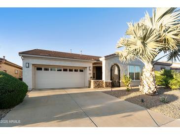 Charming single-story home with a well-maintained front yard and two-car garage at 4320 E Ficus Way, Gilbert, AZ 85298