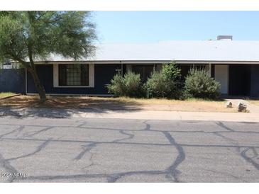 Quaint single story home with mature trees and low maintenance landscaping at 6319 E Albany St, Mesa, AZ 85205