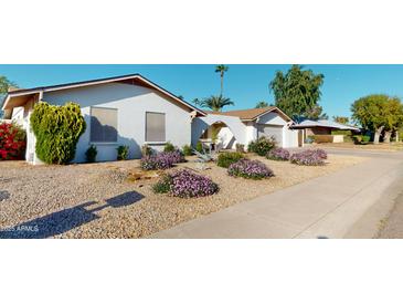 Charming single-story home with desert landscaping and a covered entryway offering curb appeal at 4014 W Anderson Dr, Glendale, AZ 85308