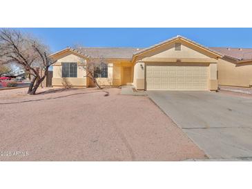Charming single-story home with a two-car garage and desert landscaping at 516 N Emery --, Mesa, AZ 85207