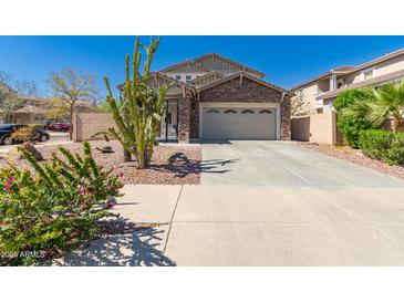 Inviting two-story home featuring a well-manicured desert landscape and a spacious two-car garage at 5430 S 23Rd Way, Phoenix, AZ 85040