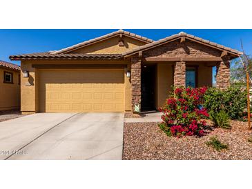 Inviting single-story home featuring a two-car garage and well-maintained landscaping at 5712 S Parkwood --, Mesa, AZ 85212