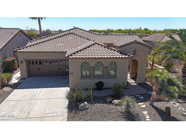 Charming home with a tile roof, desert landscaping, and a two-car garage at 12439 W Yellow Bird Ln, Peoria, AZ 85383