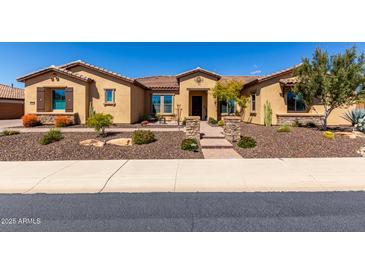 Charming single-story home featuring desert landscaping, a tiled walkway, and a covered entryway at 6112 E Calle De Pompas --, Cave Creek, AZ 85331