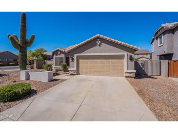 Charming single-Gathering home with a two-car garage, desert landscaping, and a stucco exterior at 23306 S 221St St, Queen Creek, AZ 85142