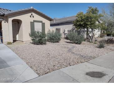 Landscaped front yard with desert foliage and a charming, single-story home at 1875 N St Francis Pl, Casa Grande, AZ 85122