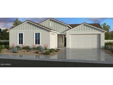 Charming single-story home featuring neutral-colored exterior, two-car garage, and drought-tolerant landscaping at 25123 N 171St Ave, Surprise, AZ 85387