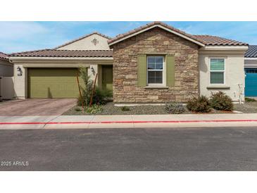 Charming single-story home featuring a two-car garage, stone accents, and well-maintained landscaping at 3842 E Bartlett Way, Chandler, AZ 85249