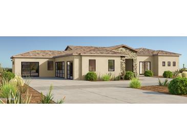 A modern, tan-colored home has a desert landscape, a tile roof, and a stone entryway, with a spacious driveway at 8233 E Camino Adele --, Scottsdale, AZ 85255