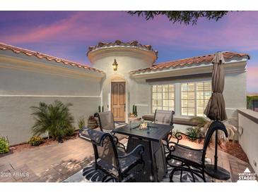 Inviting outdoor patio area with comfortable seating, perfect for relaxing and entertaining at 12860 W Junipero Dr, Sun City West, AZ 85375