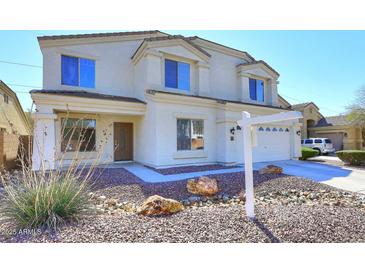 Beautiful two-story home showcasing manicured landscaping and a welcoming facade at 24113 N 26Th Pl, Phoenix, AZ 85024