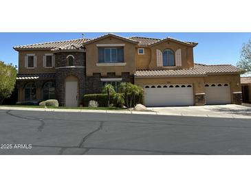 Charming two-story home with a three car garage and stone accents on the facade at 16401 S 29Th Dr, Phoenix, AZ 85045