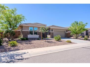 Beautiful single-story home featuring desert landscaping and a two-car garage at 4557 W South Butte Rd, San Tan Valley, AZ 85144