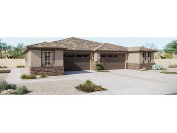 Charming single-story home with a neutral color scheme, attached two-car garage, and low maintenance desert landscaping at 5633 N 205Th Ln, Buckeye, AZ 85396