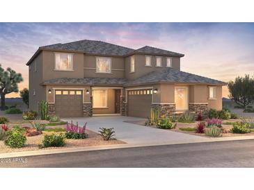 Stunning two-story home with a desert landscape and a three-car garage at 6982 W Plum Rd, Peoria, AZ 85383