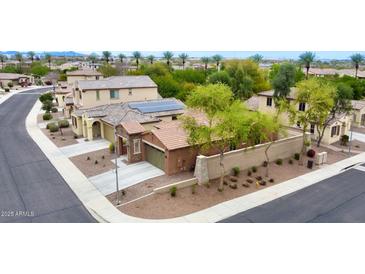 Beautiful single-Gathering home with desert landscaping, a two-car garage, and a tile roof at 9295 W Wood Dr, Peoria, AZ 85381