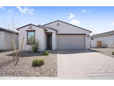 Beautiful single-story home with desert landscaping and a brick driveway at 11341 E Unger Ave, Mesa, AZ 85212