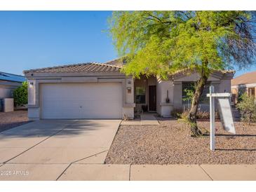 Charming single-story home featuring a well-maintained yard and a two-car garage at 1642 E Cardinal Dr, Casa Grande, AZ 85122