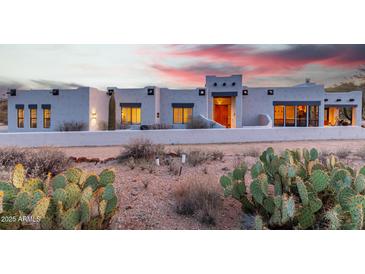 Stunning Santa Fe style home with desert landscaping and picturesque sunset views at 37646 N Dream St, Carefree, AZ 85377