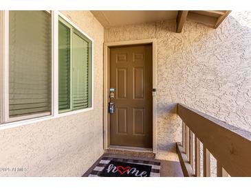 Inviting front entry with decorative door mat and secure smart lock at 520 N Stapley Dr # 286, Mesa, AZ 85203