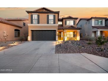 Beautiful two-story home featuring a spacious driveway and a well-maintained, xeriscaped front yard at 2435 W Via Dona Rd, Phoenix, AZ 85085