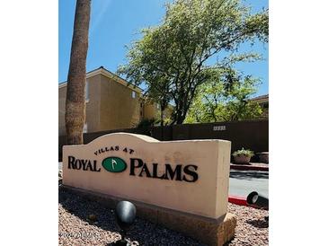 Community sign for Villas at Royal Palms features a tree and address number at 1335 E June St # 113, Mesa, AZ 85203